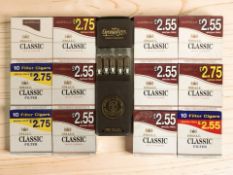 A pack of five Antonio y Cleopatra cigars, and several further packs of small classic filter cigars.