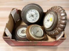 A group of antique and reproduction barometers.