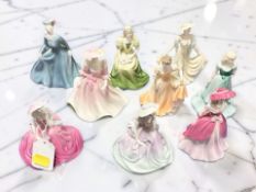 Nine miniature Coalport lady figures