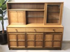 A Nathan teak cocktail sideboard, fitted cupboards and drawers, 153 cm x 46 cm x 137 cm.