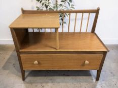 A 20th century teak telephone seat, width 90 cm.