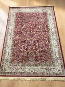 A machine made rug of Iranian design, 236 cm x 156 cm.
