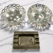 A pair of pierced silver bonbon dishes, diameter 10cm, together with a silver ashtray engraved 