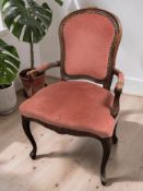 A reproduction French-style stained beech salon armchair.