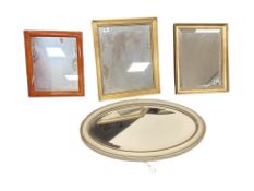Five 20th century mirrors in various styles of frame, the largest 55 cm x 85 cm.