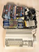 An Amiga Commodore A500 Plus system, together with various boxed and unboxed games,