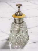 A crystal atomiser with silver and yellow guilloche enamel lid, height 12.5 cm.