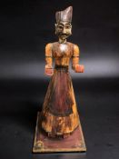 An Indian polychrome painted rocking figure of a man, height 96 cm.