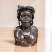 An ethnic carved hardwood bust of a lady, height 23 cm.