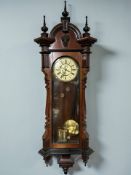 A 19th century mahogany and ebonised eight day Vienna wall clock, with enameled 8
