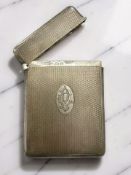 A silver card case with engine turned decoration, Birmingham 1929.