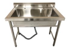 A stainless steel commercial sink,
