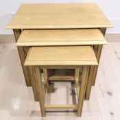 A contemporary oak effect nest of three tables, width 68 cm.
