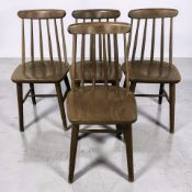 A set of four 20th century stained beech spindle back dining chairs.