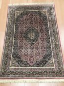 A Tabriz rug, North-West Iran, 210 cm x 141 cm.