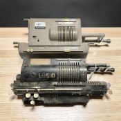 Two 20th century mechanical calculators, width 37 cm.