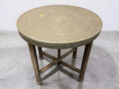 An Islamic brass topped circular occasional table, diameter 60 cm.