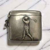 A silver vesta case decorated in relief with golfer in full swing, Walker & Hall, Birmingham 1910.