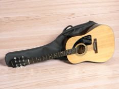 An Epiphone AJ-10 acoustic guitar, with soft carry bag.