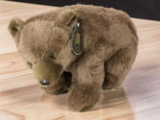 A Nuzzlers bear, with tag, length 51 cm.
