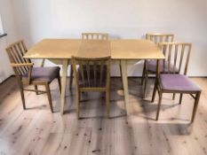 A 20th century teak extending rectangular dining table, overall 150 cm x 75 cm x 77 cm,
