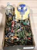 Various toys and figurines including Masters of the Universe, footballers, Star Wars R2-D2 box, etc.