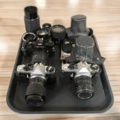 A Pentax ME Super 35mm SLR camera body with SMC Pentax-M Zoom 1:3.5 28mm lens, 1:4.