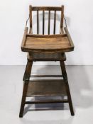 A 20th century beech child's high chair, height 89 cm.