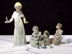 A Lladro figure group of a boy with puppies, No.
