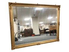 A Victorian style gilt and bevelled over mantel mirror, 138 cm x 107 cm.