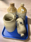 Two stoneware jugs, one marked 'J H Wright, Botanical Brewer, Lincoln',