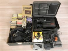 A collection of 8-track cassettes, Panasonic video camera, cassette players, gaming joystick, etc.