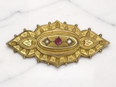 A 9ct gold ruby and pearl memorial brooch, width 5.3cm CONDITION REPORT: 7.7g gross.
