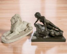 An alabaster figure of a recumbent lion, length 25 cm,