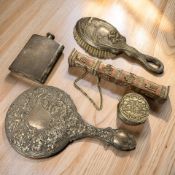 An antique embossed silver mounted hand mirror, Birmingham marks,