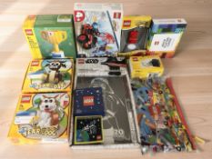 A group of Lego models in boxes, Lego International Space Station patch,