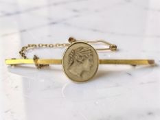 A 9ct gold lava cameo bar brooch, width 4.