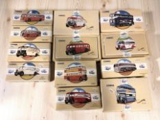 A group of Corgi Classic Commercials die cast busses in boxes