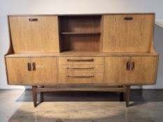 A G-Plan Fresco teak cocktail sideboard, 188 cm x 44 cm x 122 cm.