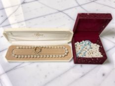 A small group of costume pearl necklaces, brooch, etc.