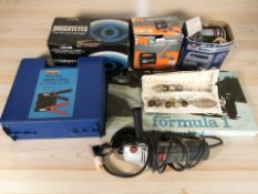 A group of power tools, Waddingtons Formula 1 car racing game, car battery,