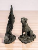 A Heredites resin figure of an otter, height 30 cm, and a further resin figure of a seated dog.
