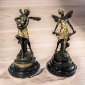 A pair of patinated bronze figures of fairies after Auguste Moreau on black marble plinths,