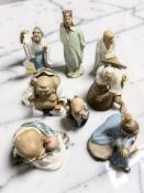 Eight Chinese earthenware figures of elders.