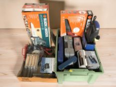 A group of boxed power and hand tools including Black & Decker,