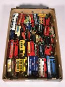 A collection of unboxed die cast busses, classic cars,