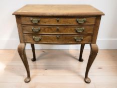 A 1920's burr walnut three drawer bow front cutlery chest on pad feet, 79 cm x 47 cm x 82 cm.