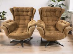 A pair of 20th century swivel lounge armchairs in deep buttoned burnt orange fabric,