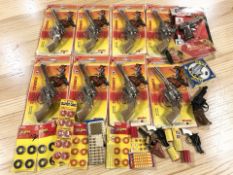 A group of Lone Star Super Cowboy Western revolver toy pistols in packaging,