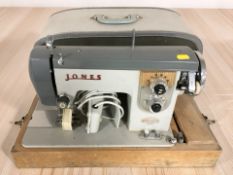 A vintage Jones electric sewing machine with lead and pedal.